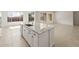 Open concept kitchen island with granite counters, stainless steel dishwasher, and modern fixtures at 26160 S 225Th Way, Queen Creek, AZ 85142