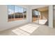 Bright living area with natural light, tile flooring, and view to outdoor patio through glass doors at 26160 S 225Th Way, Queen Creek, AZ 85142