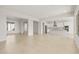 Open living space with white kitchen, an island, and lots of natural light at 26160 S 225Th Way, Queen Creek, AZ 85142