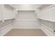 Spacious walk-in closet with carpeted floor and multiple shelves for optimal storage at 26160 S 225Th Way, Queen Creek, AZ 85142