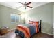 Serene bedroom showcasing a comfortable bed and warm colors that create a cozy retreat at 30185 W Flower St, Buckeye, AZ 85396