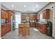 Bright and airy kitchen featuring stainless steel appliances, an island and a pantry at 30185 W Flower St, Buckeye, AZ 85396