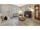Inviting living room featuring a fireplace, tiled floors, and neutral paint scheme at 30185 W Flower St, Buckeye, AZ 85396