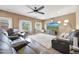 Inviting living room featuring a sectional couch, large windows, and an airy atmosphere at 30185 W Flower St, Buckeye, AZ 85396