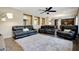 Open-concept living room featuring recessed shelving and views of the kitchen at 30185 W Flower St, Buckeye, AZ 85396