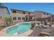 A private backyard with a refreshing pool, patio, desert landscaping and privacy fence at 30185 W Flower St, Buckeye, AZ 85396