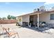 Spacious backyard boasts a large brick patio, mature landscaping, and comfortable outdoor seating for relaxation at 3237 S Albert Ave, Tempe, AZ 85282