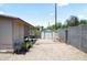 Cozy backyard featuring a storage shed, mature landscaping, and a paved patio for outdoor entertaining at 3237 S Albert Ave, Tempe, AZ 85282