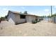 View of backyard with stone ground cover, paved seating area, and privacy fence at 3237 S Albert Ave, Tempe, AZ 85282