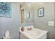 Bathroom featuring a white sink vanity with a mirror and decorative art on the wall at 3237 S Albert Ave, Tempe, AZ 85282
