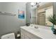 Bathroom with a white sink vanity, a mirror, and a view of the glass door shower at 3237 S Albert Ave, Tempe, AZ 85282