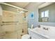 Bathroom featuring a shower with a glass door, a toilet, and a sink vanity at 3237 S Albert Ave, Tempe, AZ 85282