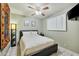 This bedroom includes tile floors, a ceiling fan, and a modern platform bed at 3237 S Albert Ave, Tempe, AZ 85282