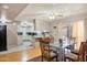 Open-concept dining room with glass-top table, seamlessly connecting to a bright kitchen at 3237 S Albert Ave, Tempe, AZ 85282