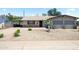 Charming single story home featuring a low maintenance desert landscaped front yard and attached carport at 3237 S Albert Ave, Tempe, AZ 85282