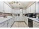 Well-equipped kitchen boasts plenty of cabinet space, black appliances, and tile flooring at 3237 S Albert Ave, Tempe, AZ 85282