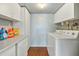 Bright laundry room with cabinets and a washer and dryer at 3237 S Albert Ave, Tempe, AZ 85282