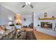 Comfortable living room featuring a cozy fireplace, neutral paint, and hardwood floors at 3237 S Albert Ave, Tempe, AZ 85282