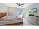 Bedroom with natural light, a ceiling fan, and a mounted flat screen television at 3441 N 31St St # 118, Phoenix, AZ 85016