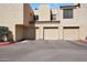 Image of a home's garages and covered parking with desert landscape and rock details at 3441 N 31St St # 118, Phoenix, AZ 85016