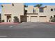 Image of a home's garages and covered parking with desert landscape and rock details at 3441 N 31St St # 118, Phoenix, AZ 85016