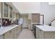 Bright kitchen features stainless appliances, granite countertops and access to the living space at 3441 N 31St St # 118, Phoenix, AZ 85016