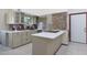 Modern kitchen boasts custom cabinetry, quartz countertops, stainless appliances, and colorful mosaic tiling at 3441 N 31St St # 118, Phoenix, AZ 85016