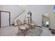 A bright living room featuring high ceilings, cozy seating, and a neutral color palette at 3441 N 31St St # 118, Phoenix, AZ 85016