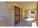 Charming gated porch with a table and chairs providing a welcoming entry at 3441 N 31St St # 118, Phoenix, AZ 85016