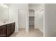 Well-lit bathroom featuring a single sink vanity, and walk-in shower at 3480 N 307Th Dr, Buckeye, AZ 85396