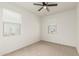 Well-lit carpeted bedroom with two windows provides a sunny and inviting space at 3480 N 307Th Dr, Buckeye, AZ 85396