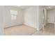 A carpeted bedroom featuring a bright window at 3480 N 307Th Dr, Buckeye, AZ 85396