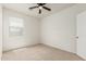 Neutral carpeted bedroom with a window provides a bright and clean living space at 3480 N 307Th Dr, Buckeye, AZ 85396