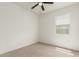 Sunlit bedroom with neutral carpet and a ceiling fan provides a comfortable space at 3480 N 307Th Dr, Buckeye, AZ 85396