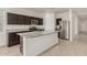 A kitchen featuring granite countertops, stainless steel appliances, and dark wood cabinets at 3480 N 307Th Dr, Buckeye, AZ 85396