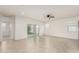 Open-concept living area with tile floors, natural light, and a ceiling fan at 3480 N 307Th Dr, Buckeye, AZ 85396