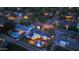 Aerial shot highlighting a well-lit backyard, a pristine pool, solar panels, and an inviting outdoor entertainment area at 3653 E Highland Ave, Phoenix, AZ 85018