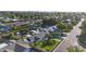 Aerial view of home with a manicured lawn, mature trees, and a spacious backyard at 3653 E Highland Ave, Phoenix, AZ 85018