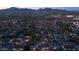 Stunning aerial view of a residential neighborhood with mountain backdrop at dusk, showcasing community ambiance and neighborhood layout at 3653 E Highland Ave, Phoenix, AZ 85018