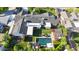 Aerial view showcasing pool, manicured backyard, patio, and solar panels on the home's roof at 3653 E Highland Ave, Phoenix, AZ 85018