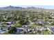 Community aerial view featuring single-Gathering homes, desert landscaping, and mountain views at 3653 E Highland Ave, Phoenix, AZ 85018