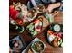 A variety of delicious appetizers and snacks arranged on a wooden board and plates, ideal for sharing at 3653 E Highland Ave, Phoenix, AZ 85018