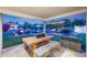Covered patio with an outdoor dining area and views of the lush backyard and pool at 3653 E Highland Ave, Phoenix, AZ 85018