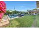 Spacious backyard with a sparkling pool, perfect for enjoying sunny days and outdoor activities at 3653 E Highland Ave, Phoenix, AZ 85018