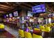 A lively bar interior with ample seating, multiple TVs, and stylish decor at 3653 E Highland Ave, Phoenix, AZ 85018
