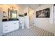 Bright bathroom featuring a white vanity, decorative tile floor, and a glass-enclosed shower at 3653 E Highland Ave, Phoenix, AZ 85018