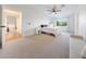 Bright bedroom with natural light, neutral tones, and cozy seating, offering a relaxing and inviting space at 3653 E Highland Ave, Phoenix, AZ 85018