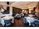 Elegant dining room with set tables and seating arrangements for a restaurant experience at 3653 E Highland Ave, Phoenix, AZ 85018