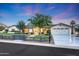 Exterior view of a modern farmhouse-style home with a well-manicured lawn and spacious driveway at 3653 E Highland Ave, Phoenix, AZ 85018