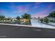 Beautiful exterior view of a modern farmhouse-style home with a manicured lawn and fresh landscaping at 3653 E Highland Ave, Phoenix, AZ 85018